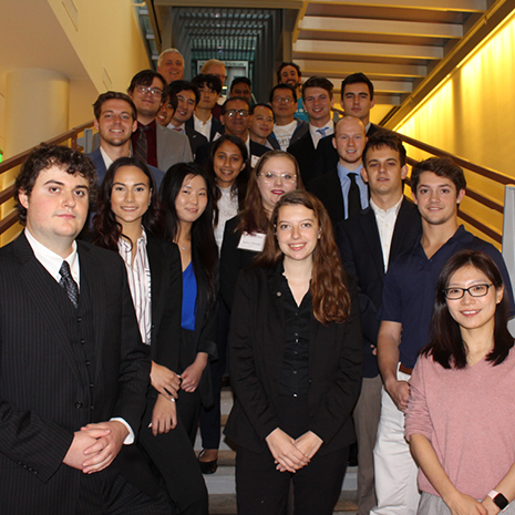 Group photo of students participating in the Analytics Hackathon on the Moore School stairs