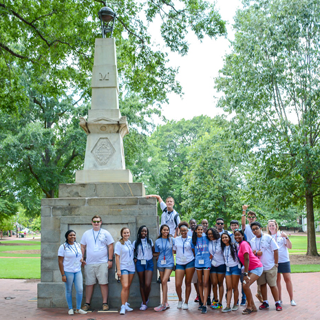 A group of SC Business Week high school students participate in a scavenger hunt on the Horseshoe in front of Maxcy Monument