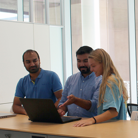  group of students sitting at a table in the data lab