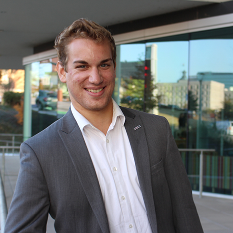 Portrait of Kendall Krenek in Moore School courtyard