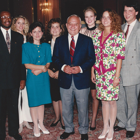 Photo of Bill Putnam surrounded by other Moore School colleagues