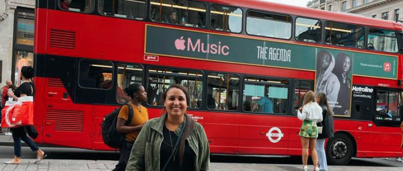 Banner Image of Chloe Mattison in front of a double-decker bus in the U.K.