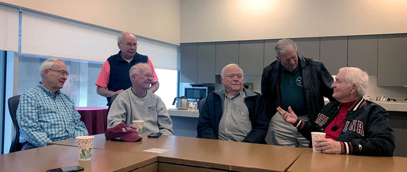 Banner Image of retired Moore School professors who meet for a regular coffee club