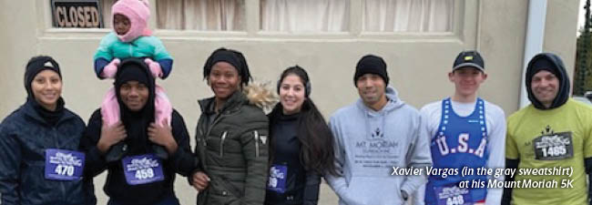 Banner Image of Xavier Vargas and participants for his 5K; caption reads: Xavier Vargas (in the gray sweatshirt) at his Mount Moriah 5K