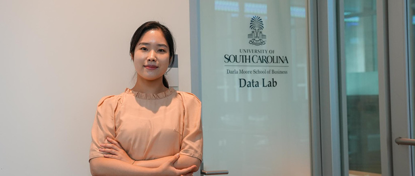 Image of Seoyoung Yoon in the doorway of the Moore School Data Lab