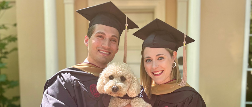 Image of Eddie and Helena Kalaf with their dog on hooding day