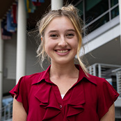 Image of Mara Voloder beside the Moore School building