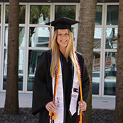 Image of Rebecca Grant in her graduation cap and gown