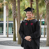 Image of Robin Thomas in his cap and gown