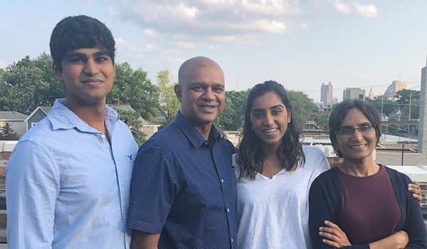 Image of Rohit Verma with his wife, son and daughter