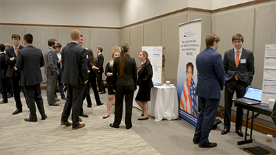 Student presenters at the Spring 2017 GSCPM Summit viewing each other's presentations