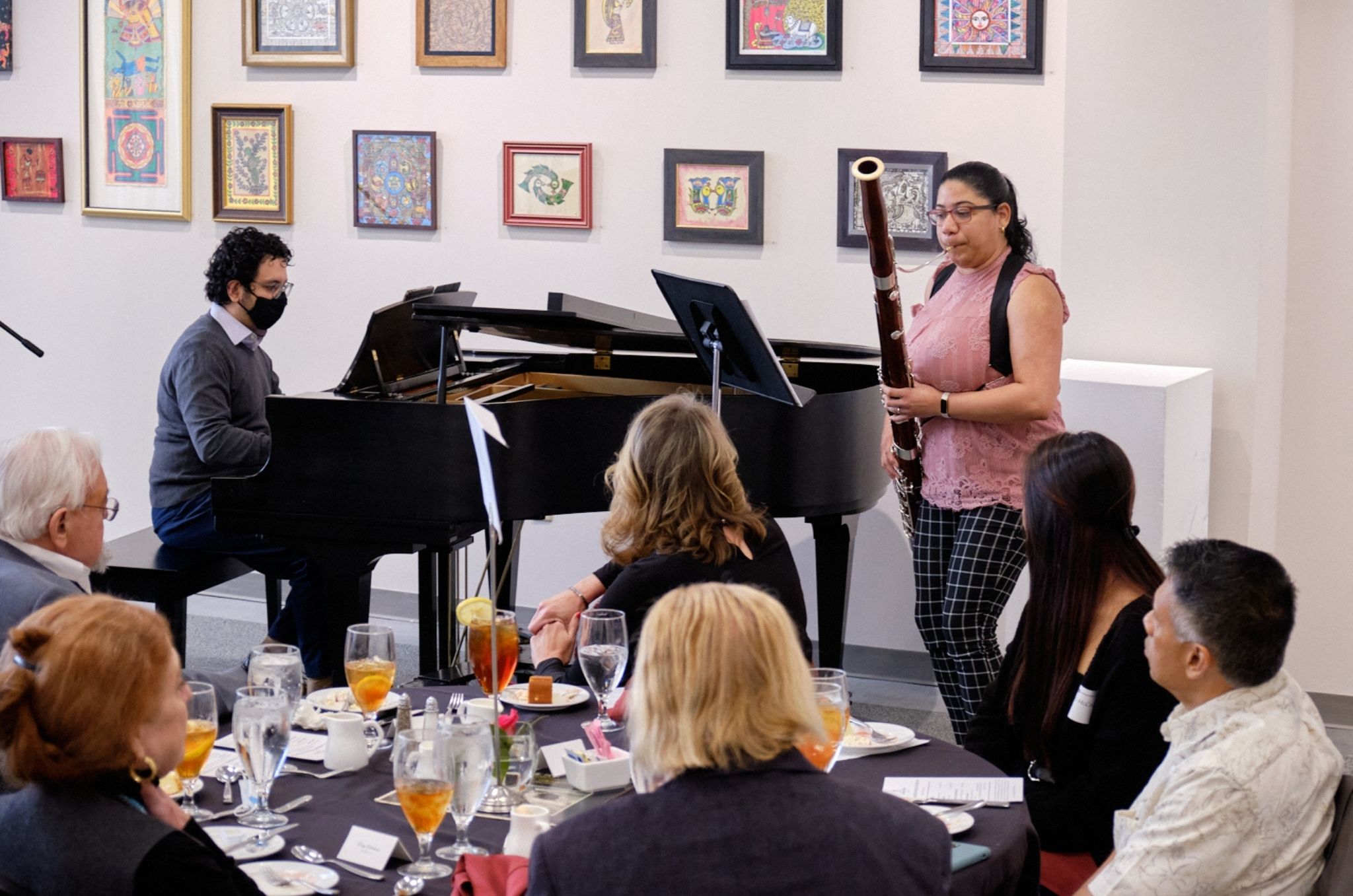 Alexandra Castro playing basson in front of donors