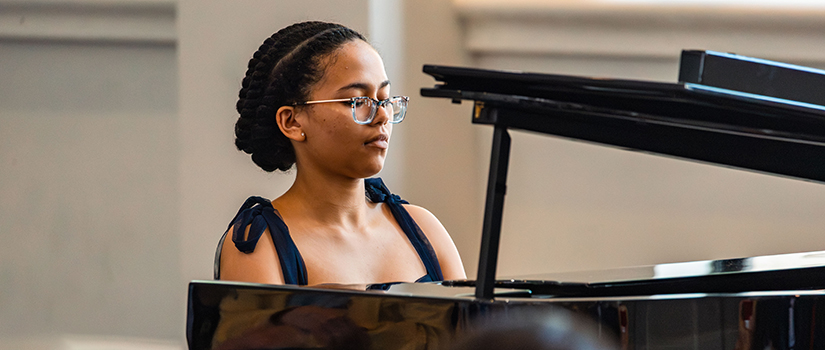 young woman playing piano