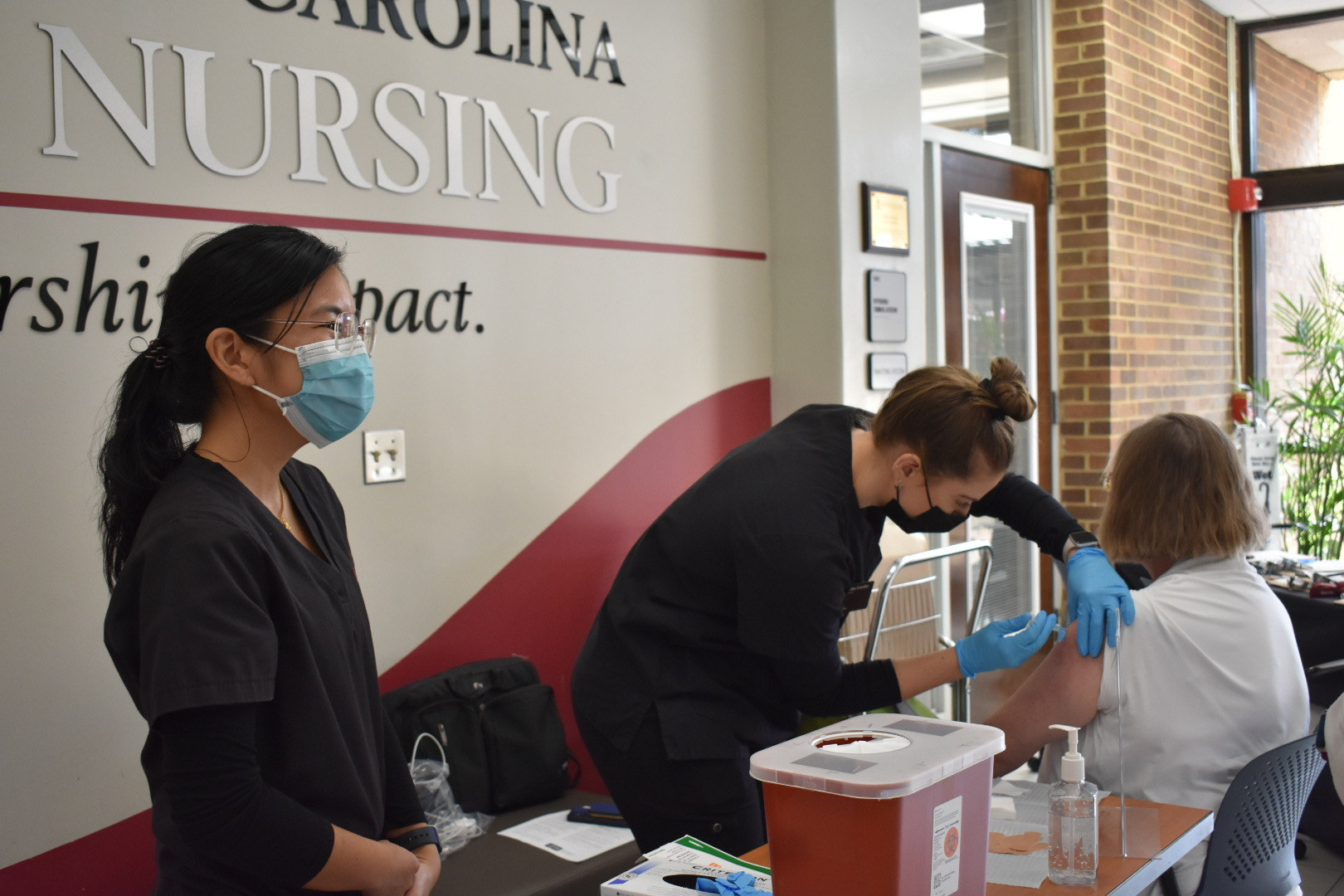 Nursing students provide flu vaccines for faculty, staff, and students. 
