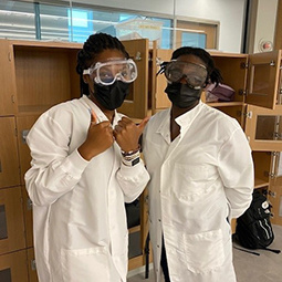 student in lab coat