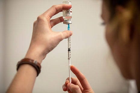 student preparing shot