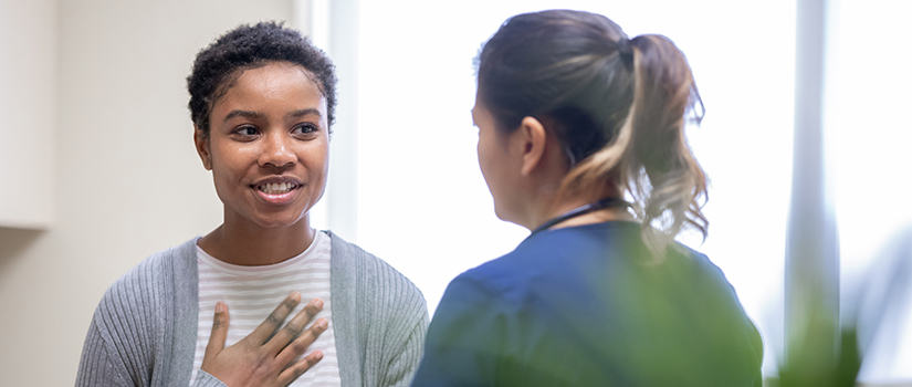 women and doctor in office 