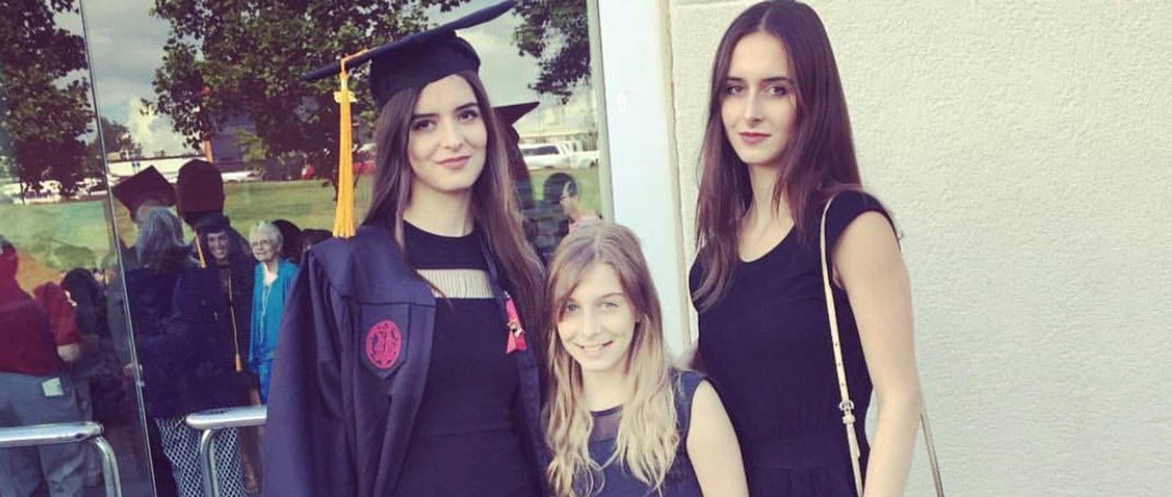 Adalin Quigley, left, and Daniella Kucherina, right, with their sister at Quigley's graduation.