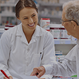 Pharmacist speaking to patient