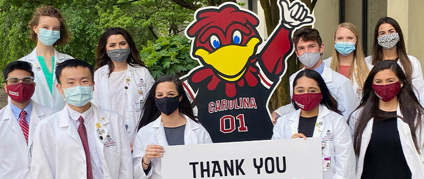 Students holding "Thank you preceptors" sign