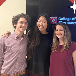 Three students standing together