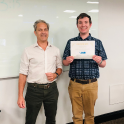 Professor and student with certificate