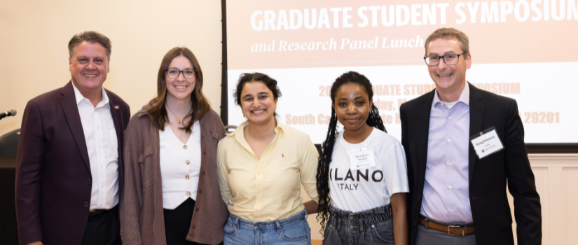 Graduate students with Dean and Professor