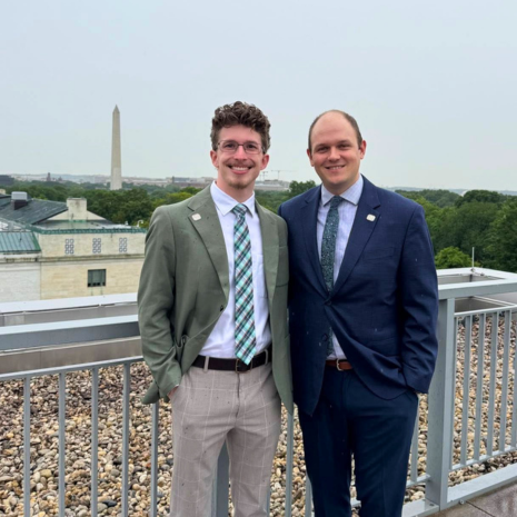 Two students pose in front of Washington Monument