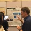 Subgrant PI Dr. Matty Demont discusses his research during the poster presentations