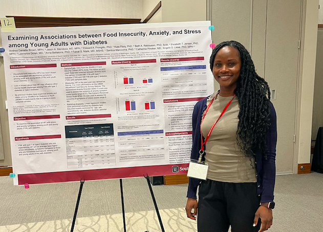 Andrea Danielle Brown presenting her poster titled, "Examining Associations between Food Insecurity, Anxiety, and Stress among Young Adults with Diabetes."
