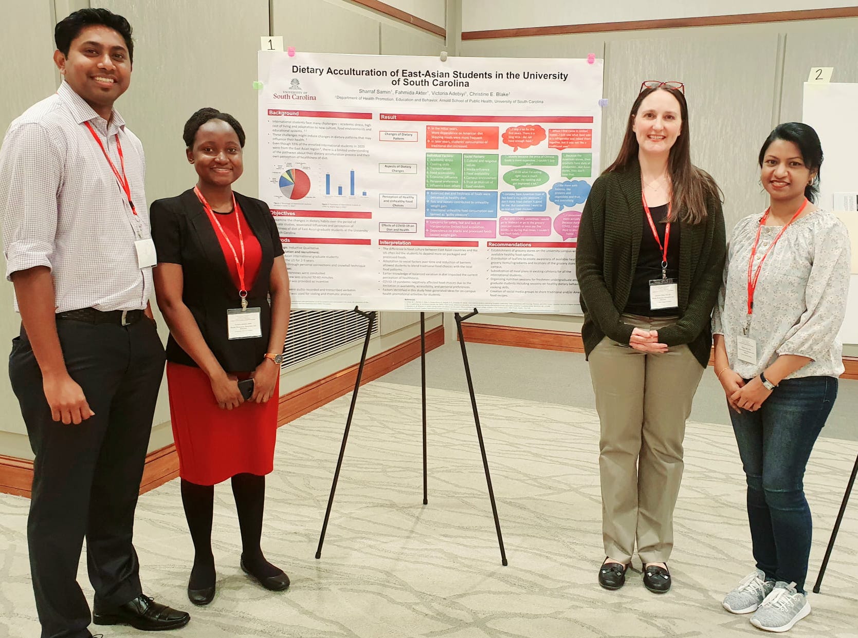 Victoria Adebiyi, Fahmida Akter, and Sharraf Samin presenting their poster titled, "Dietary Acculturation of East Asian Students in the University of South Carolina."