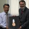 Arnold School Dean Thomas Chandler presents a gift to the President of China Medical University