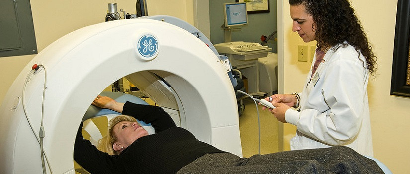 Woman inside of cancer screening machine