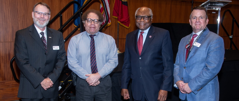 Arnold School faculty standing with U.S. representative James Clyburn