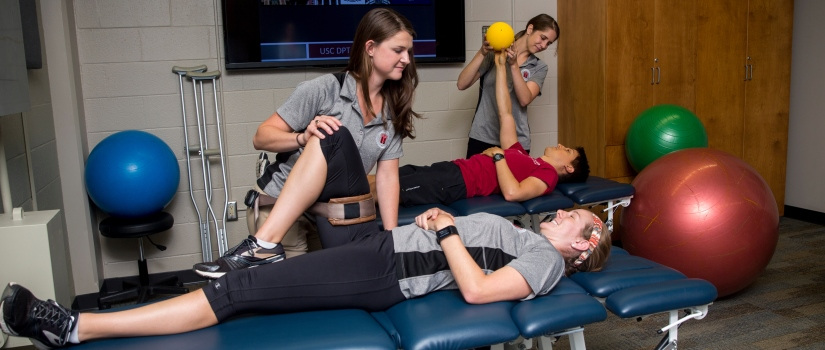Students practicing physical therapy techniques