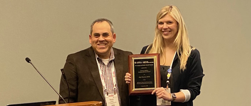 Ally Hucek receiving award