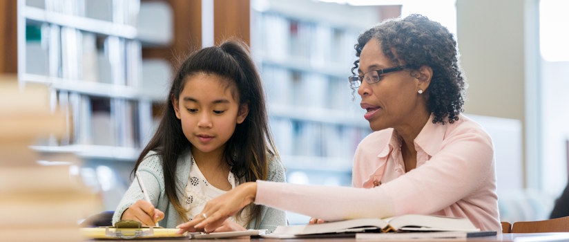 Teacher Helping Student