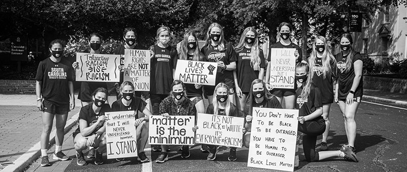 The University of South Carolina women's soccer team participates in a demonstration for racial justice in front of the Russell House.