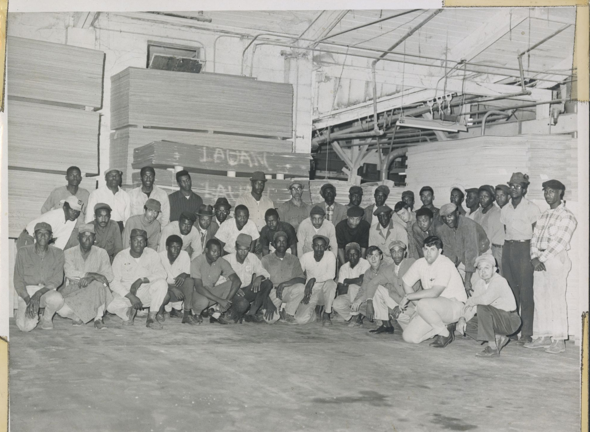 Warehouse workers pose for a photo. Williams Furniture Company is notable in that it had an integrated workforce in the South, making Williams an early stage for civil rights efforts.