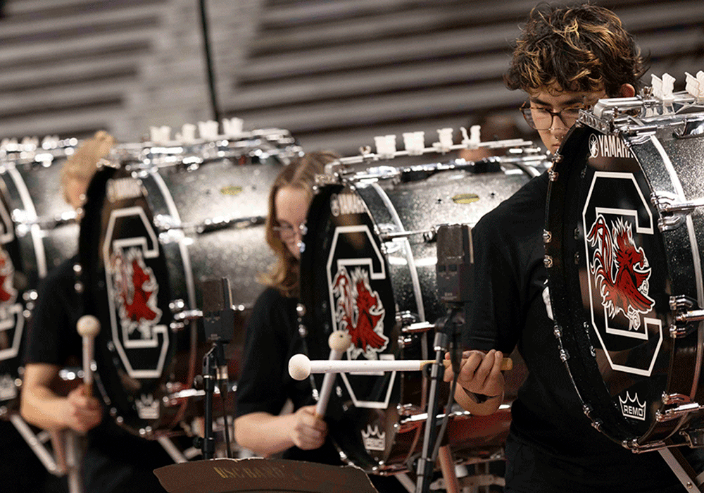 The Carolina band drum line lays down the beat.