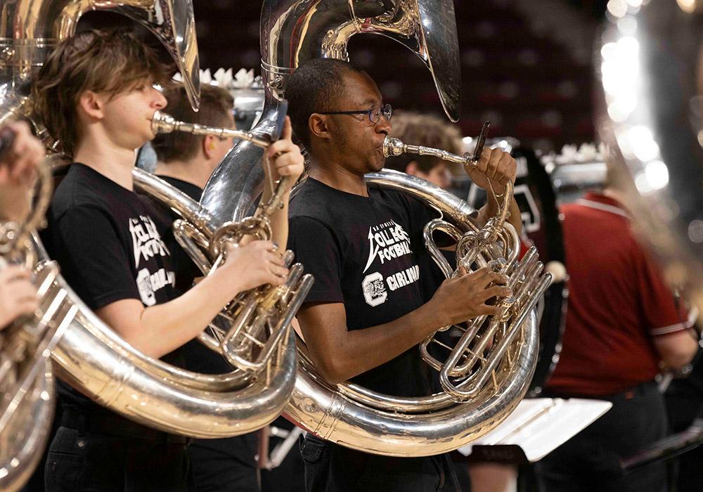 Sousaphone players put the backbone in the band’s performance.