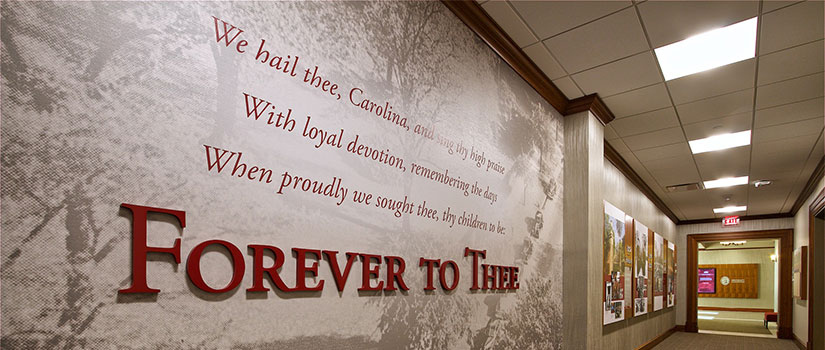 Wall with Forever to Thee mural at Alumni Center