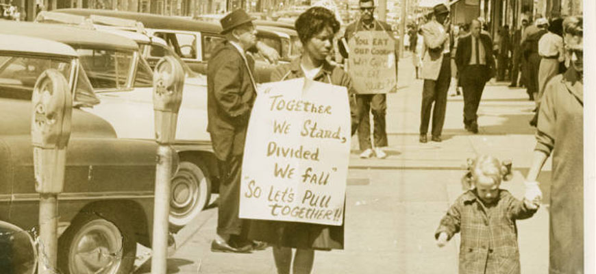 United we stand sign held by demonstrator