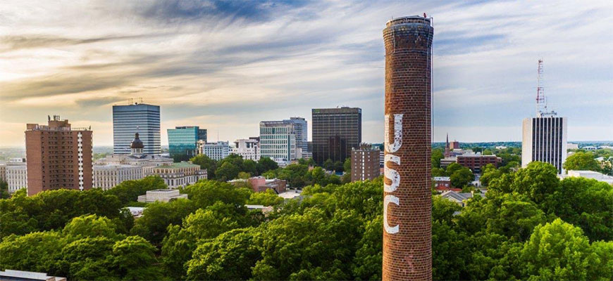 The USC smokestack rises above the skyline of Columbia