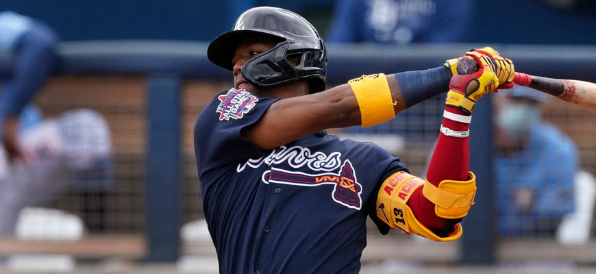 baseball player in Atlanta Braves uniform with all star logo mid-swing