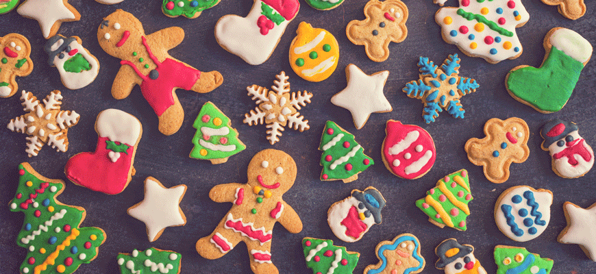 Christmas cookies in a variety of holiday shapes with multicolored icing and decorations