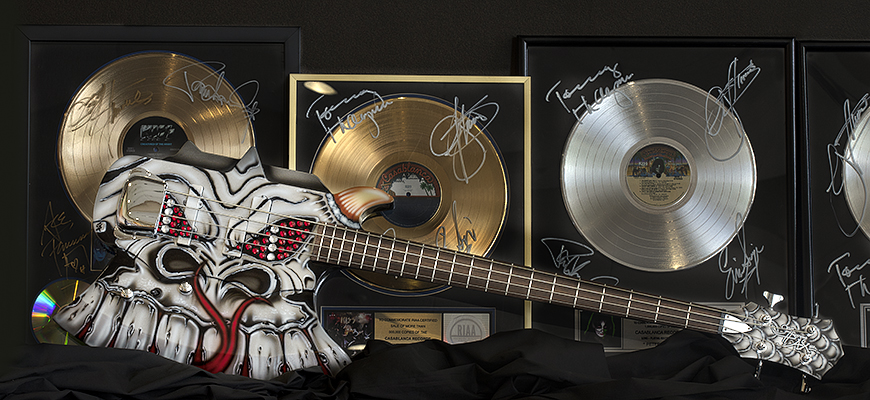 Guitar and commemorative albums are part of UofSC's KISS collection.