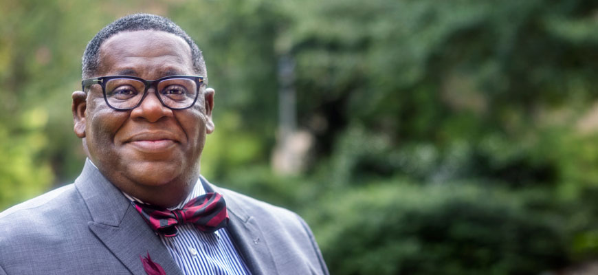 An outdoor headshot of J. Rex Tolliver wearing a bowtie and suit.