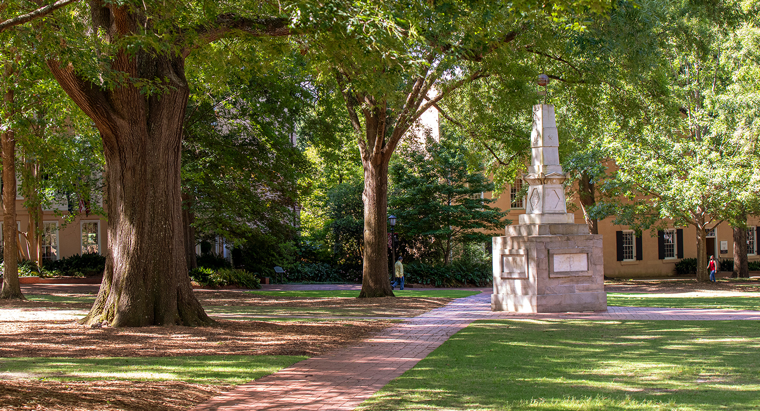 The beautiful Historic Horseshoe with lush oak trees and the Maxcy Monument. 