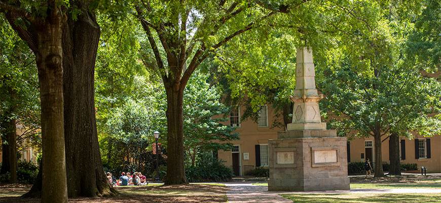 Looking across a Horseshoe sidewalk with the Maxcy Monument on the right